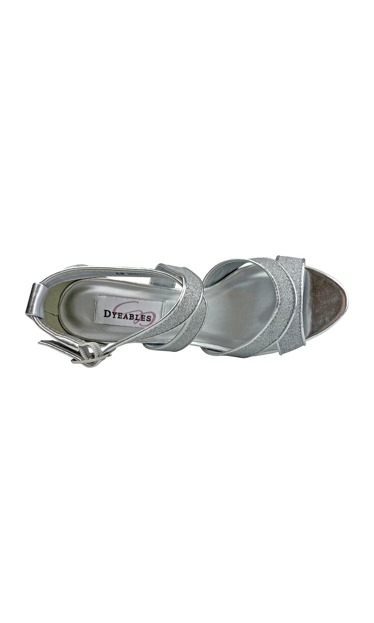 The Amber Silver Prom Shoes by Touch Ups 54716 are silver open-toe sandals with an ankle strap and buckle, seen from above. Featuring a chic 2.75-inch heel, they're perfect for prom, offering elegant comfort throughout the night.